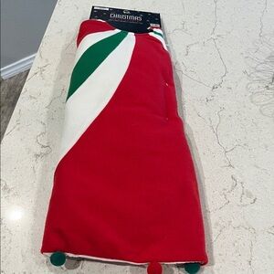 The Christmas Shoppe Red, Green and white Christmas tree skirt.